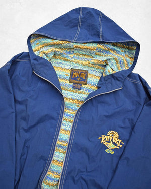 Blue jacket with colorful lining and Rip Curl logo on a white background