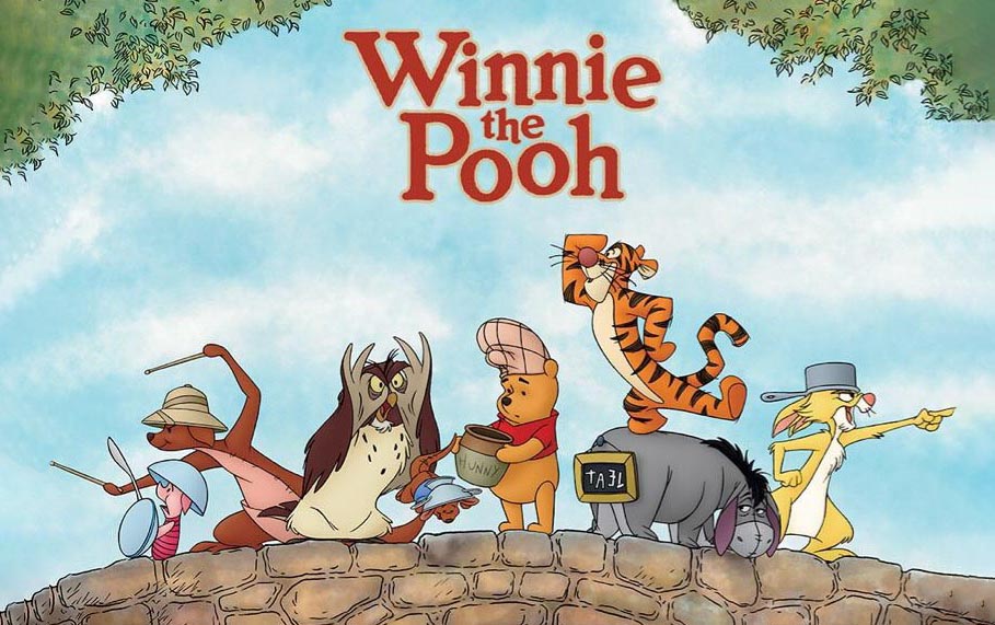 Winnie the Pooh and friends on a stone wall with 'Winnie the Pooh' text above.