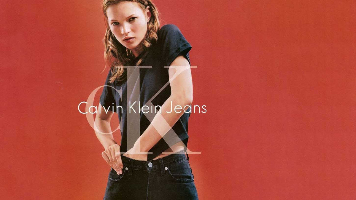 Person wearing Vintage Calvin Klein Jeans against a red background