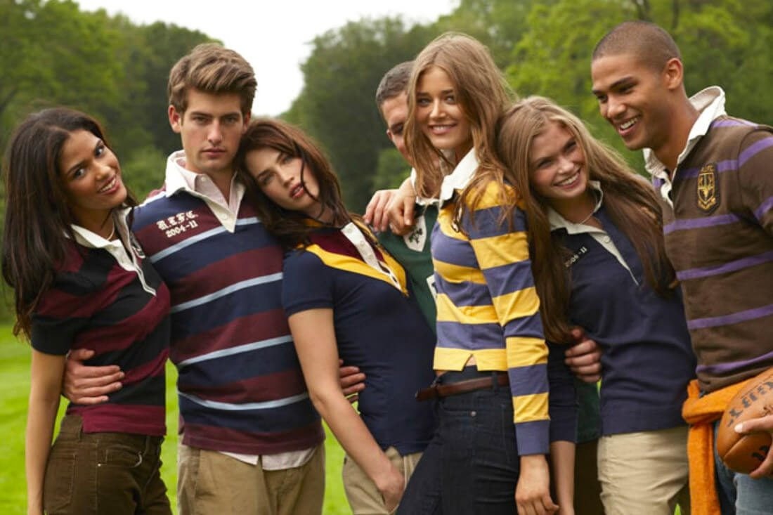 Group of people wearing Polo Ralph Lauren striped rugby shirts outdoors